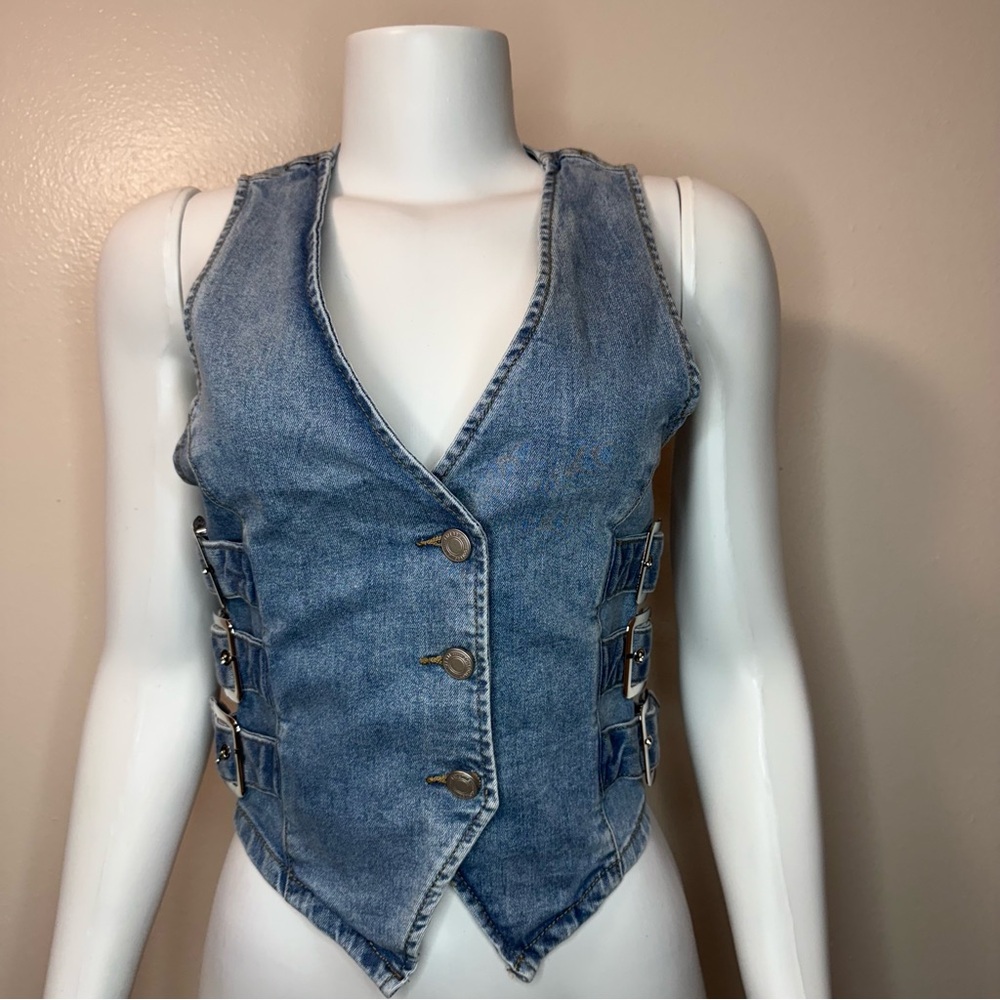 Light blue denim vest with buckle details on the sides